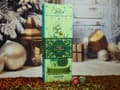 Tall green Maison laGrange box labeled Thés en vrac 2026, with a kettle illustration and two small round tins in front.