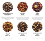 Sechs Teabloom Winter Joy Teemischungen als loser Tee mit Etiketten