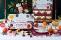 Simpson & Vail card reading Steeped in Holiday Magic and 24 Festive Teas, in front of an open red and gold drawer calendar, with a cup, fruit and spices on the table.