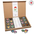 Open kraft box of numbered heart-shaped metal tins, some open to show loose leaf, a printed list card and a Handmade with Love seal.