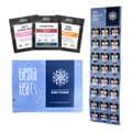 Blue Tiesta Tea box labeled 24 Day Loose Leaf Tea Advent Calendar, with snowflakes and pouches including Nutty Almond Cream, Fireside Spice and Maui Mango, some marked caffeine free, beside a Keep It Cozy board of pouches.