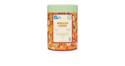 Boîte de thé Bird & Blend Mulled Cider avec une étiquette orange et un couvercle vert
