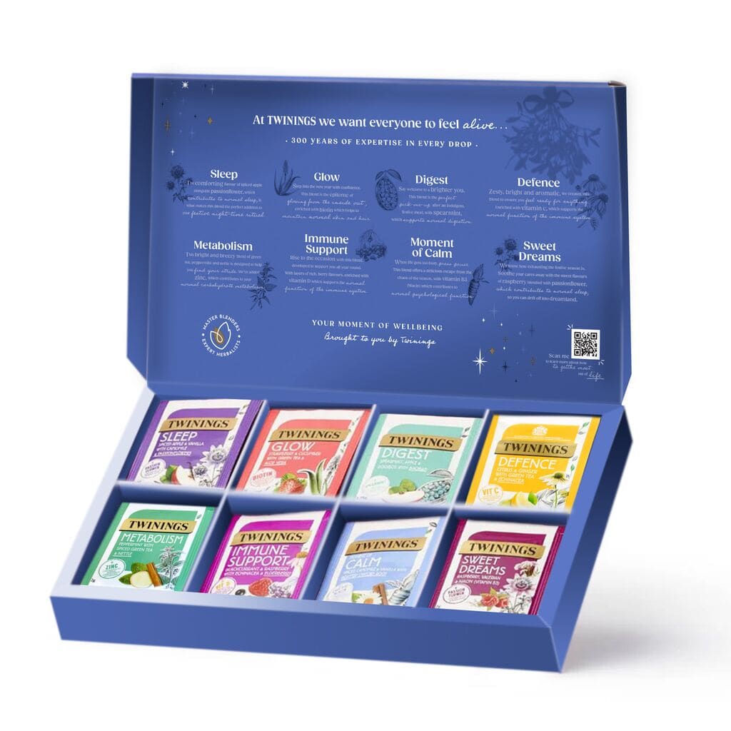 Confezione regalo di tè Twinings blu aperta con bustine di tè confezionate singolarmente
